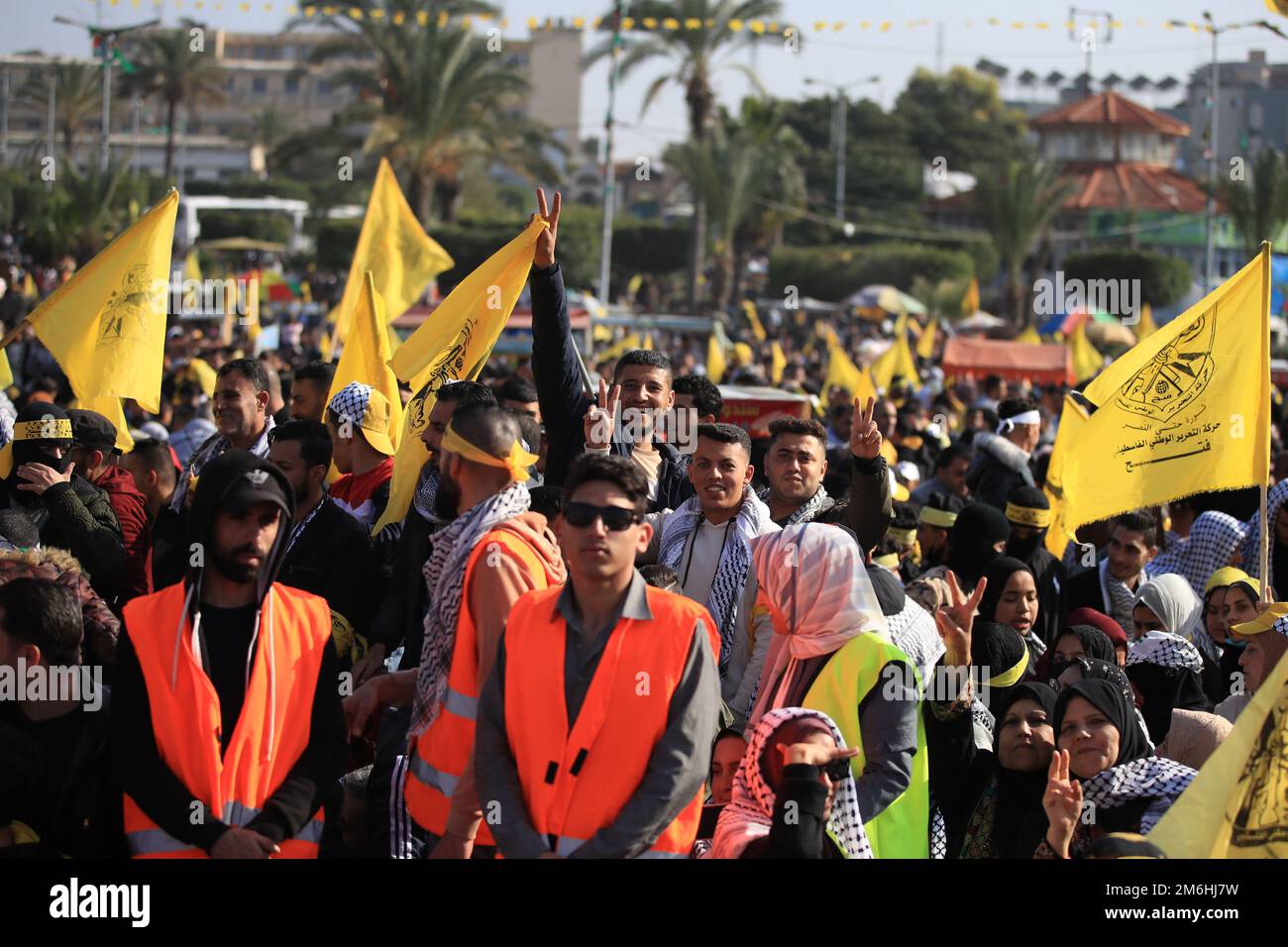 Palestinians attend a rally marking the 58th anniversary of the Fatah