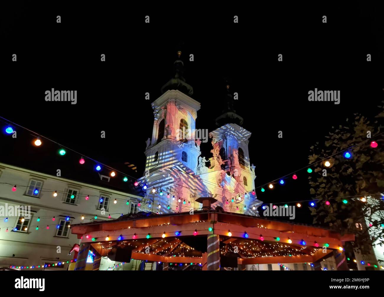 Beautiful Christmas decorations and Mariahilfer church , at night, in the city center of Graz, Styria region, Austria Stock Photo
