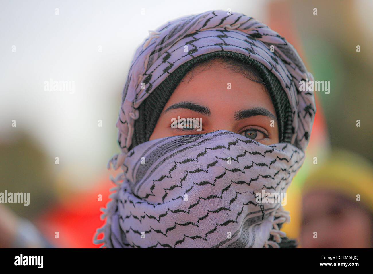 Palestinians attend a rally marking the 58th anniversary of the Fatah