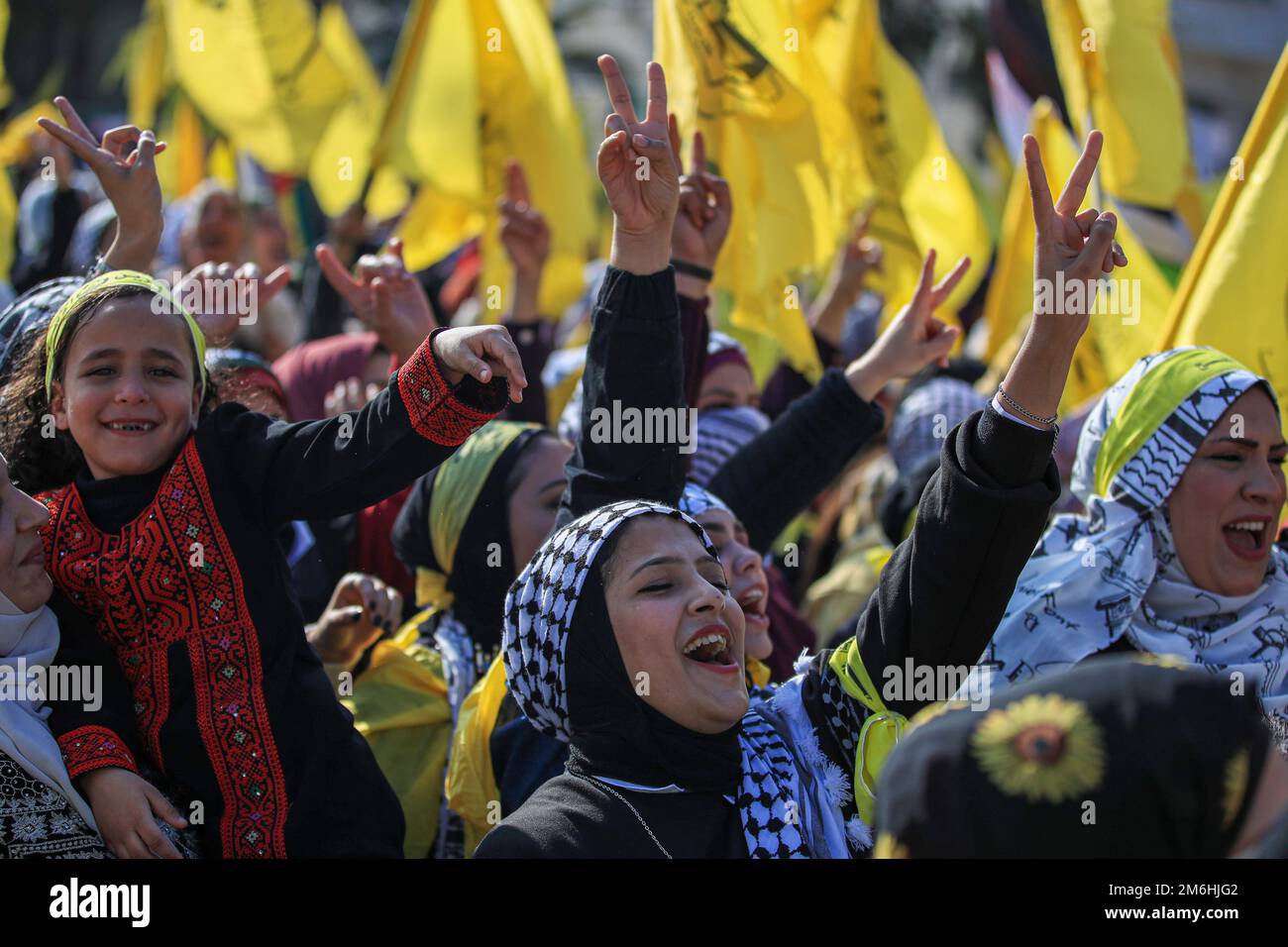 Palestinians attend a rally marking the 58th anniversary of the Fatah