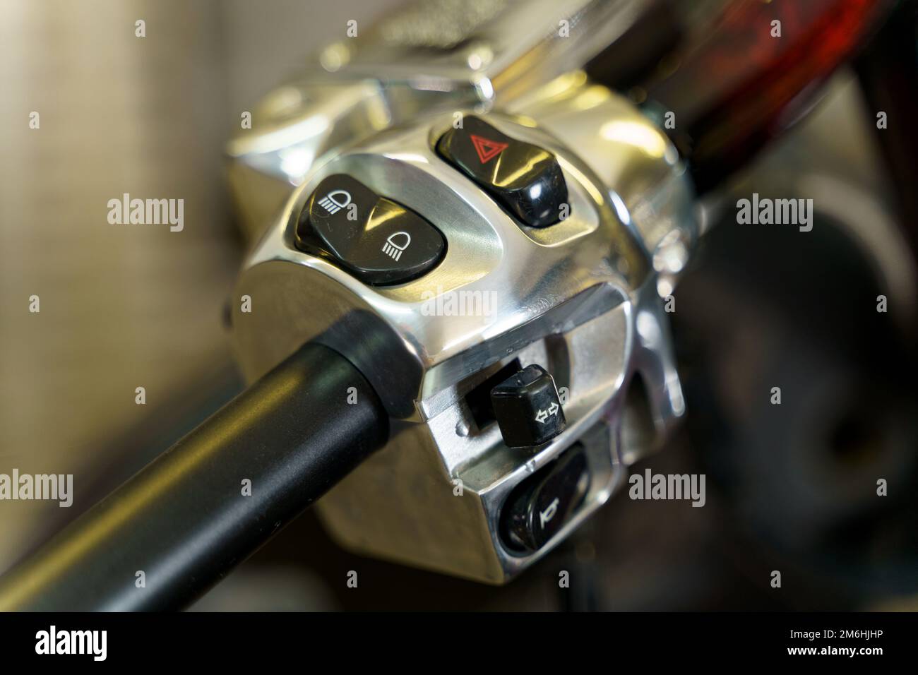 The handle of the throttle and control of lighting devices on the handlebars of a motorcycle. Close-up. Transport concept. Stock Photo