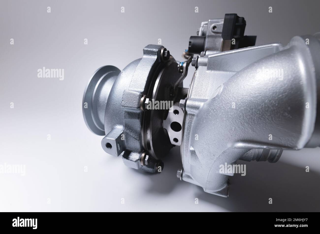 New metal turbocharger. Exhaust gas blower. Parts background Stock