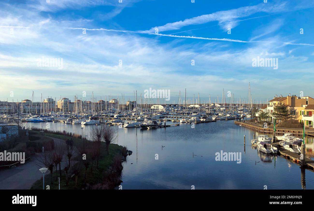 Apartments at a sea harbour in the sunset Stock Photo Alamy