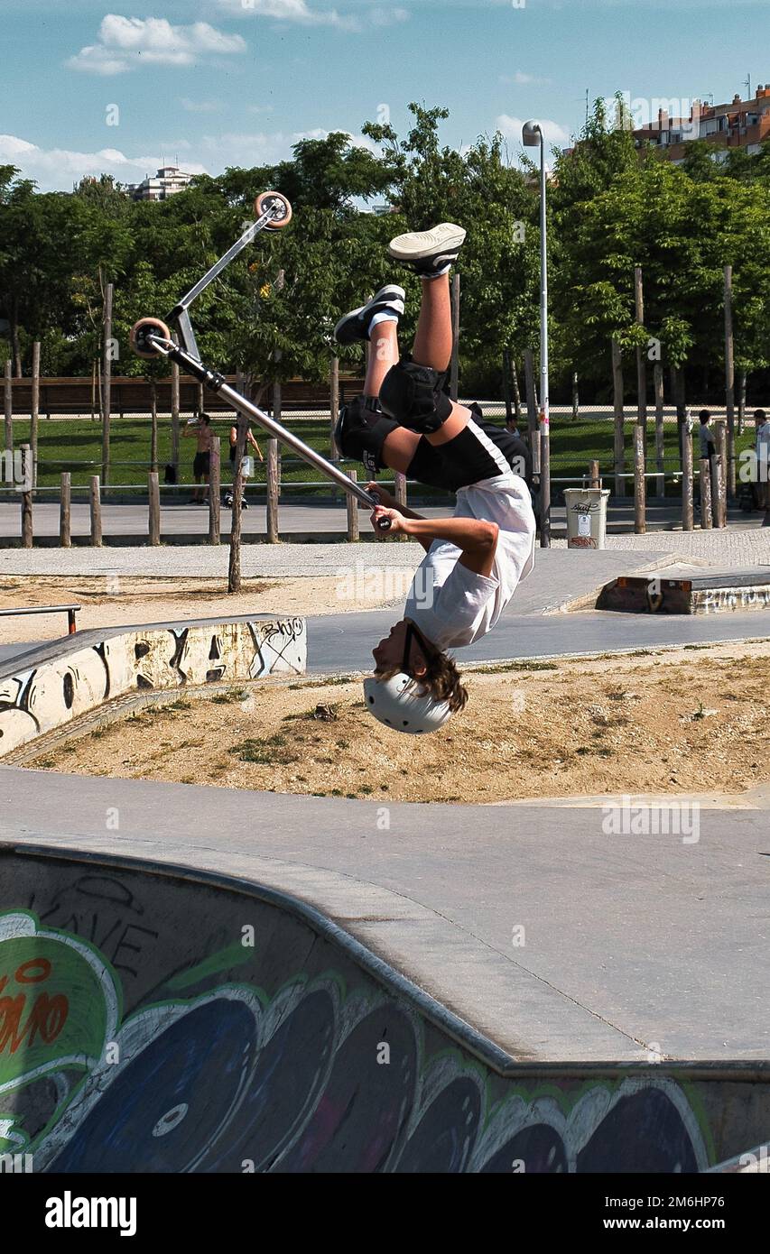 Sport with the scooter in the half pipe Stock Photo