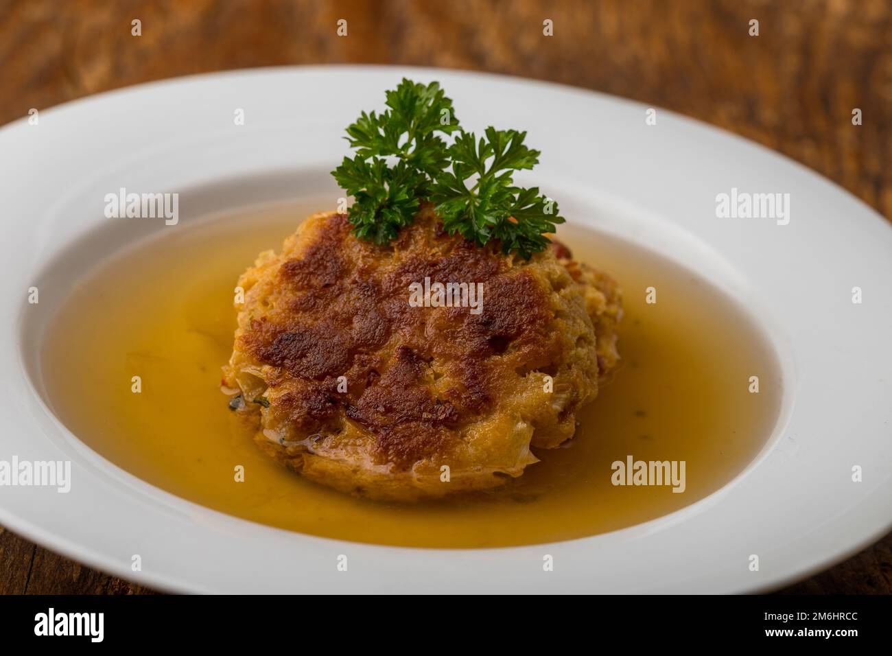 Austrian cheese dumplings in broth Stock Photo
