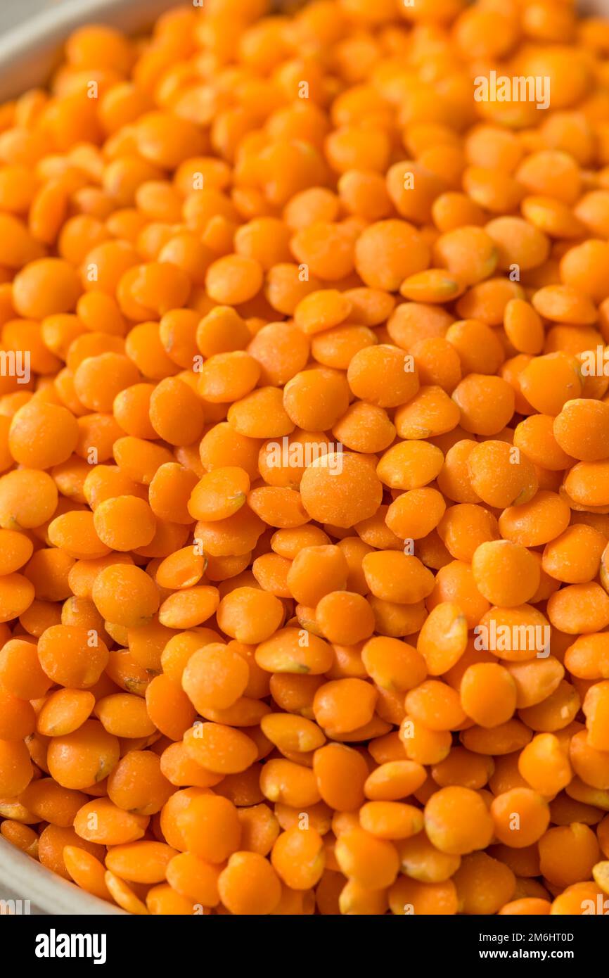 Raw Organic Red Lentils Legume in a Bowl Stock Photo