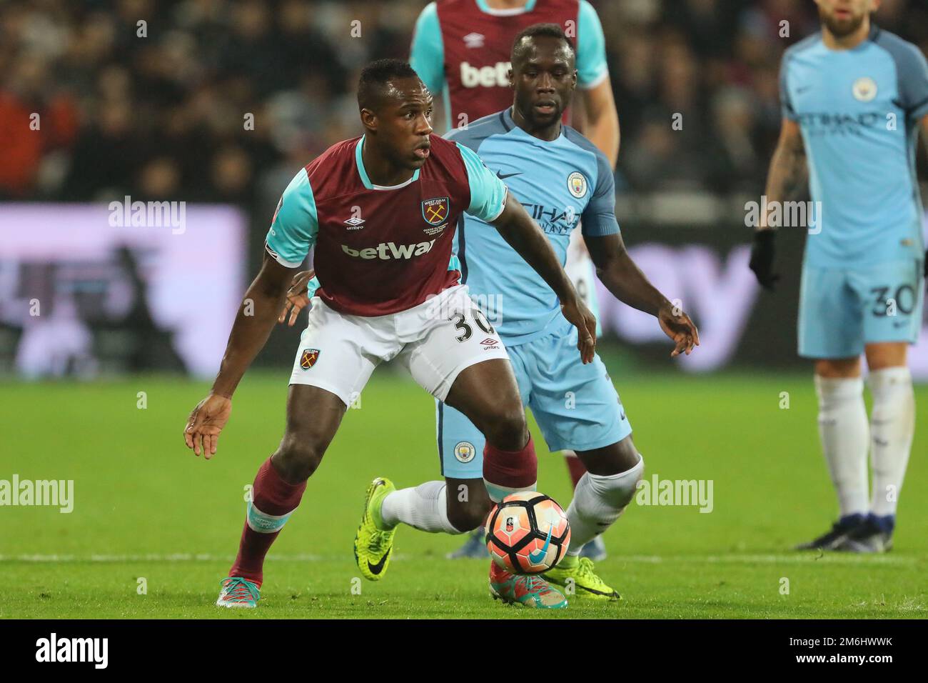 Michail Antonio of West Ham United and Bacary Sagna of Manchester City - West Ham United v Manchester City, FA Cup Third round, The London Stadium, London - 6th January 2017. Stock Photo
