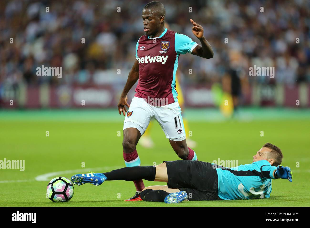 Axel Maraval of NK Domzale pokes the ball away from Enner Valencia of West Ham United - West Ham United v NK Domzale, UEFA Europa League second leg third round qualifier, The London Stadium, Stratford, London - 06 August 2016.Picture by Richard Calver Stock Photo