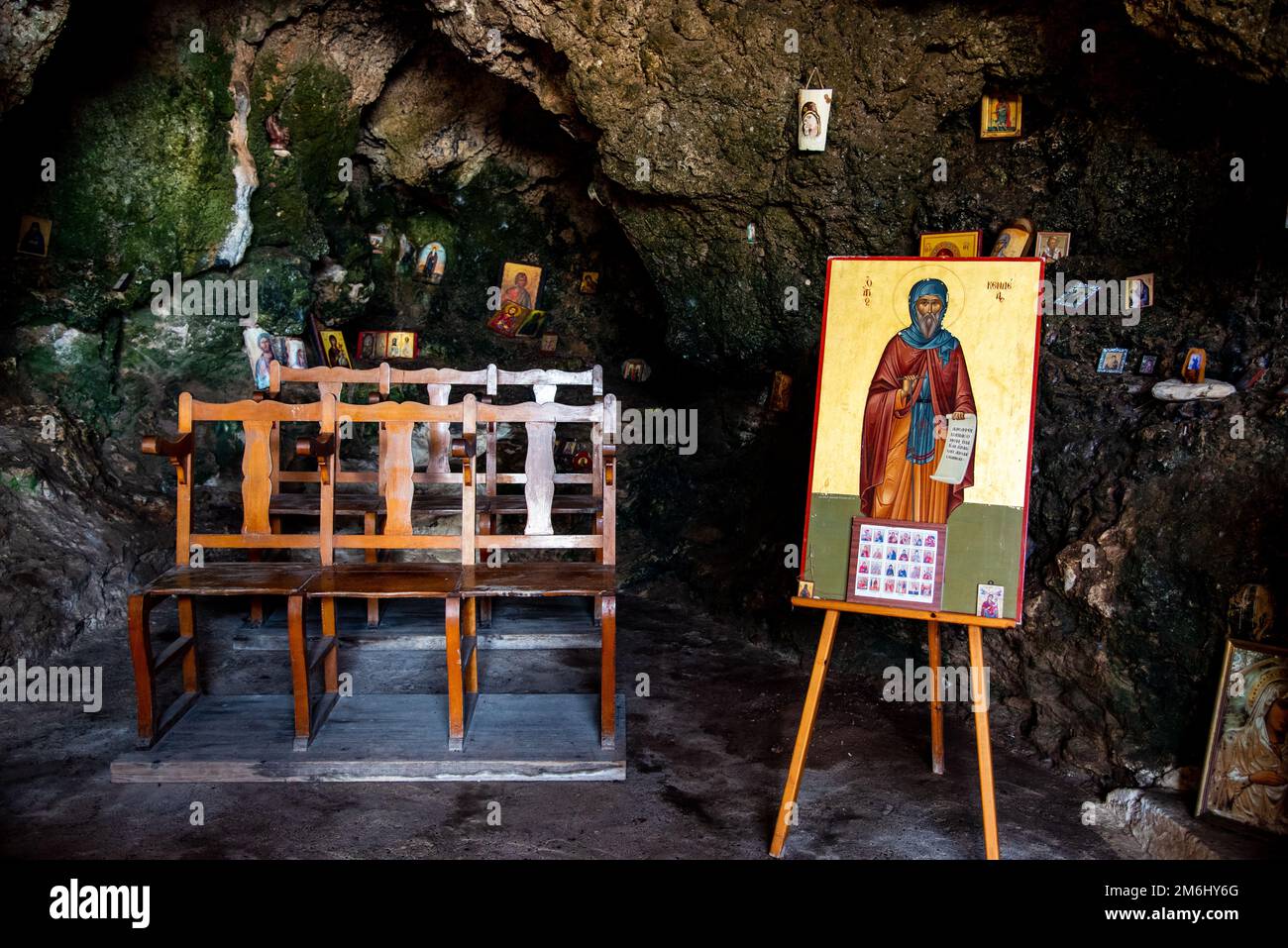 Interior of an old church cave with Christian saint pictures. Ayioi Saranta orthodox chapel Stock Photo