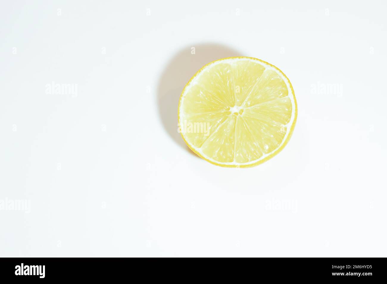 Lemon cut in half on white hi-res stock photography and images - Alamy
