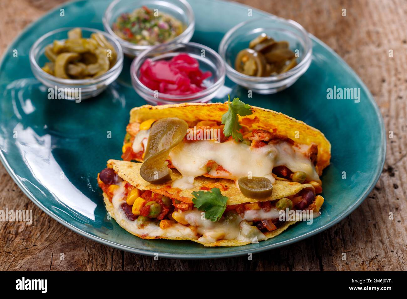Mexican tacos baked with cheese Stock Photo Alamy