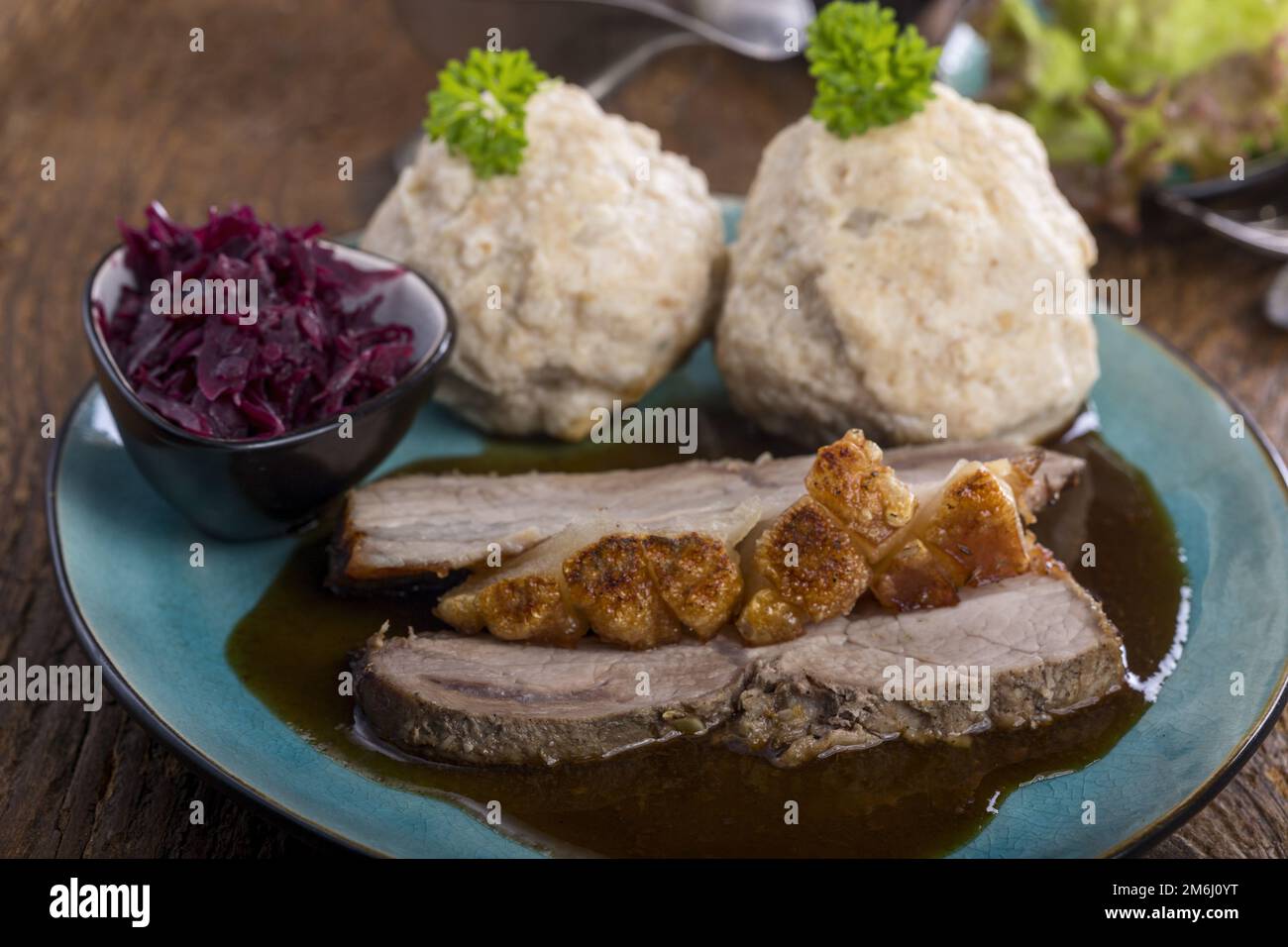 Bavarian roast pork with dumplings Stock Photo Alamy