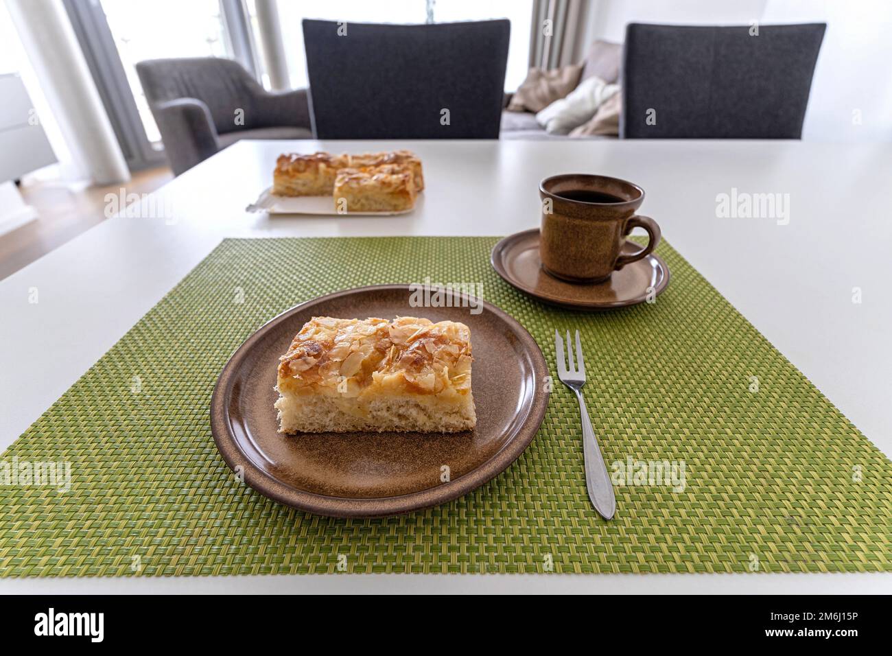 traditional North German Butterkuchen (butter cake) on dining table Stock Photo