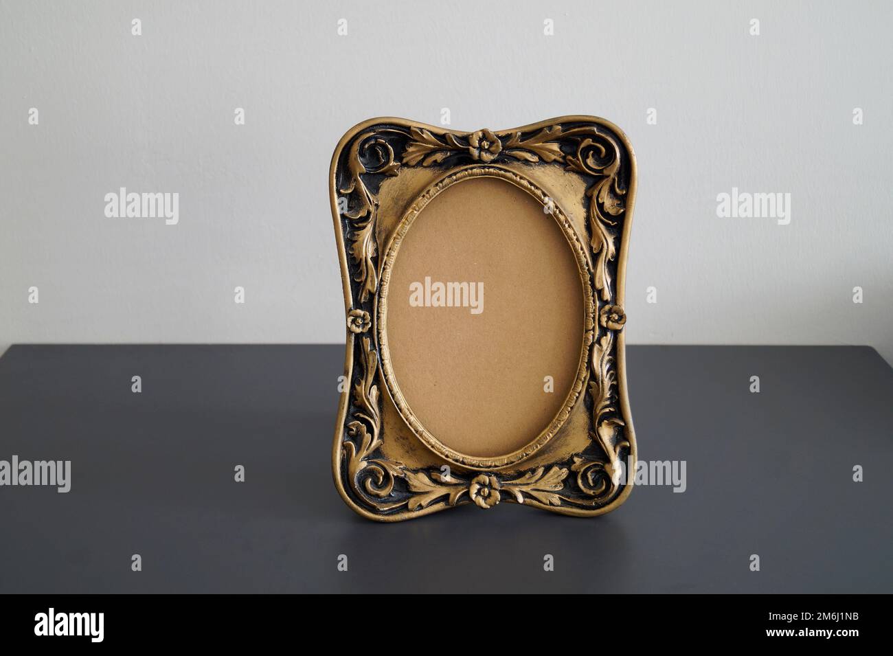 Hollow old photo frame on table Stock Photo Alamy