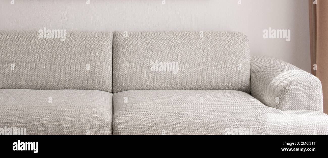 Warm grey sofa close up. Minimalistic furniture concept Stock Photo Alamy