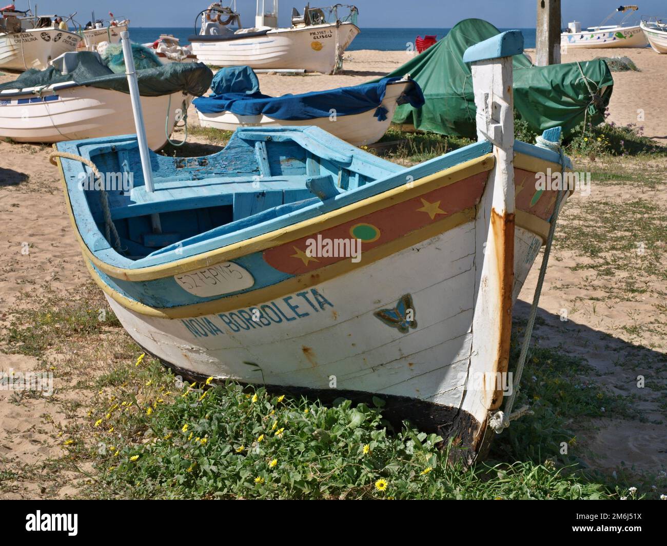 Traditional fishing boat on Armacao de Pera beach, Algarve - Portugal Stock Photo