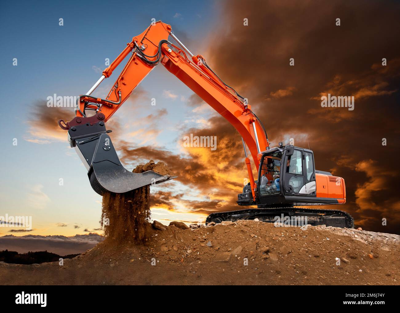 Heavy excavator working on construction site Stock Photo - Alamy