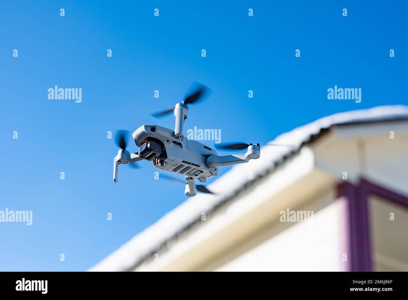 Quadcopter in flight Stock Photo - Alamy