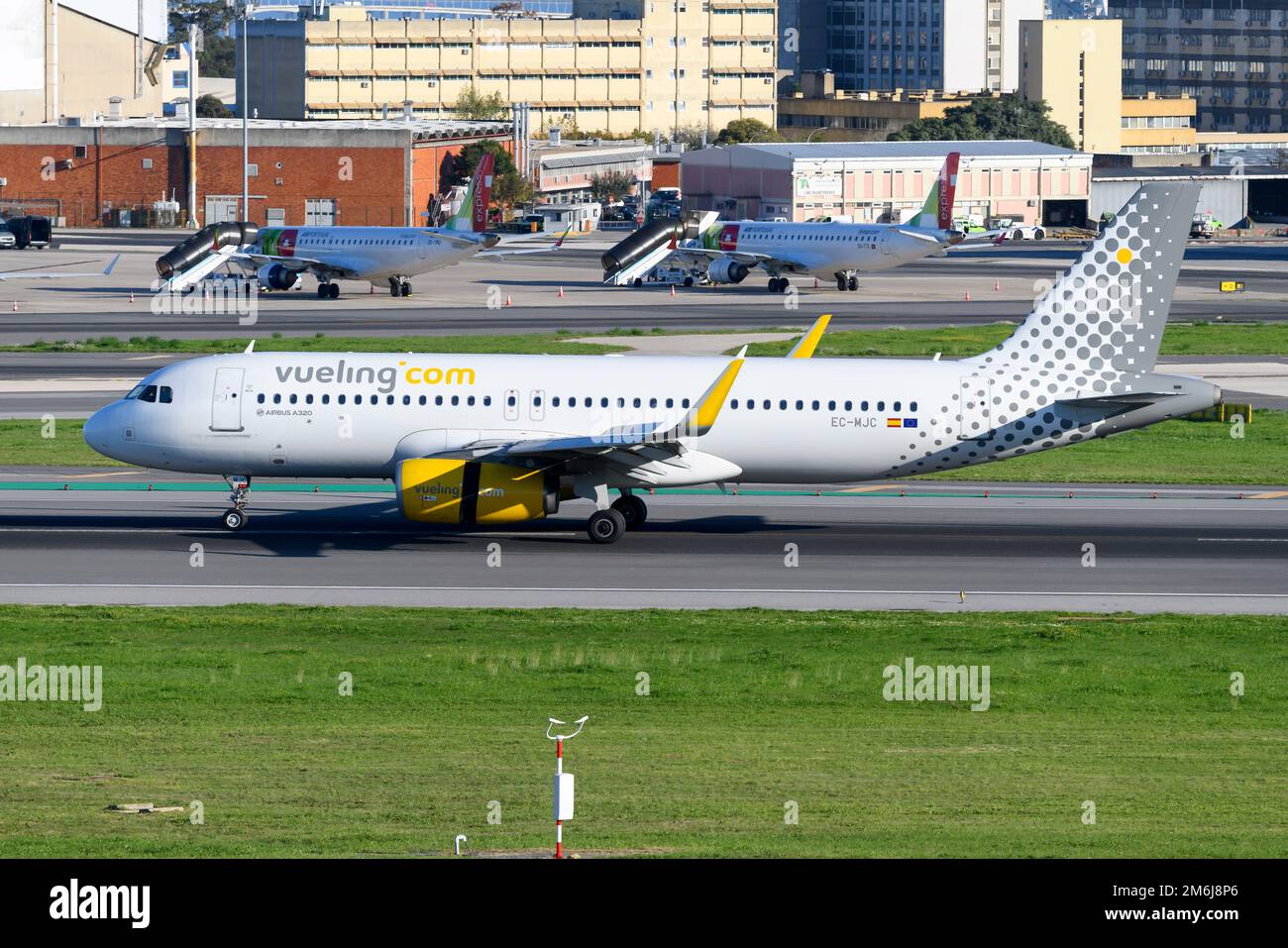 Vueling Airlines A320 plane landing at Lisbon Airport. Airplane A320 of spanish low cost airline. Vueling Airlines aircraft. Stock Photo