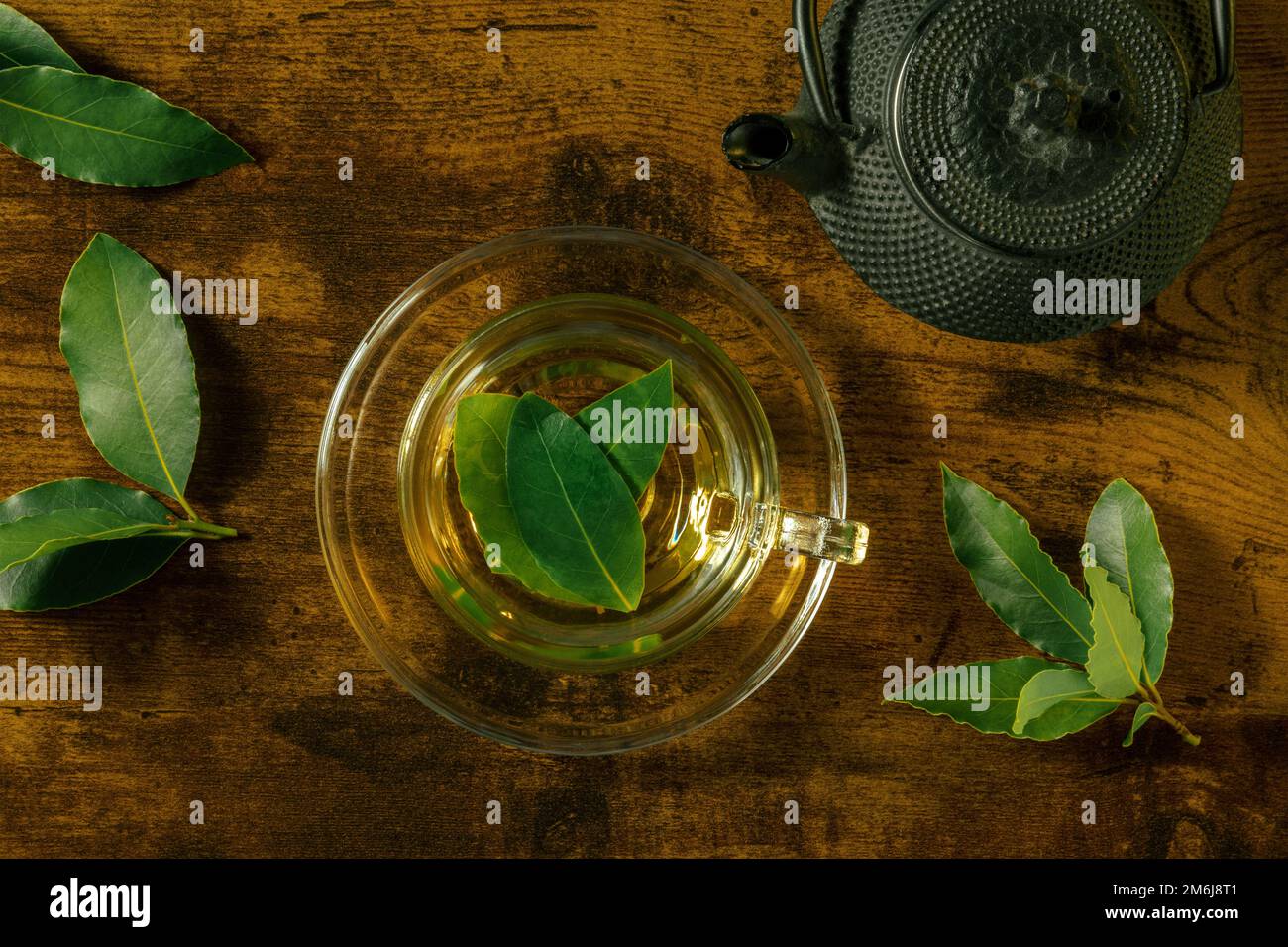 Bay leaf tea, overhead flat lay shot. Laurel leaves infusion in a cup