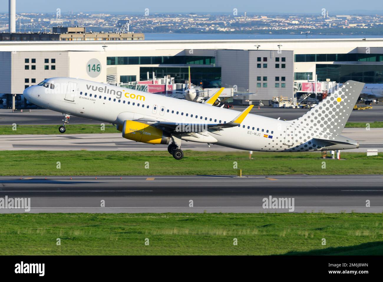 Vueling Airlines A320 airplane taking off at Lisbon Airport. Aircraft A320 of spanish low cost airline. Vueling Airlines plane. Stock Photo