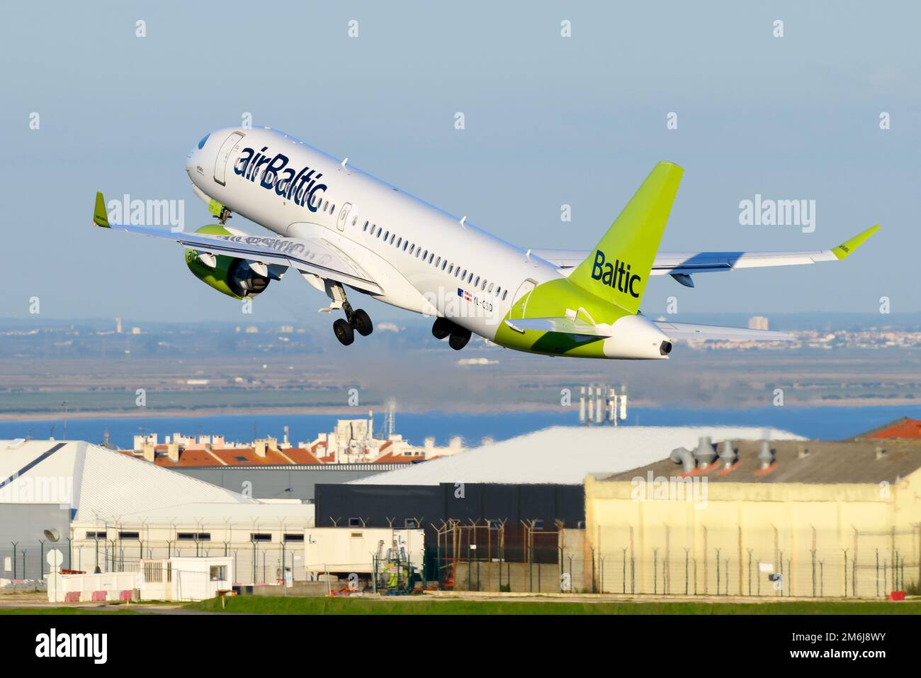 AirBaltic Airbus A220 aircraft taking off from Lisbon. Airplane formerly know as Bombardier CSeries 300 of Air Baltic taking off to Riga, Lativa. Stock Photo