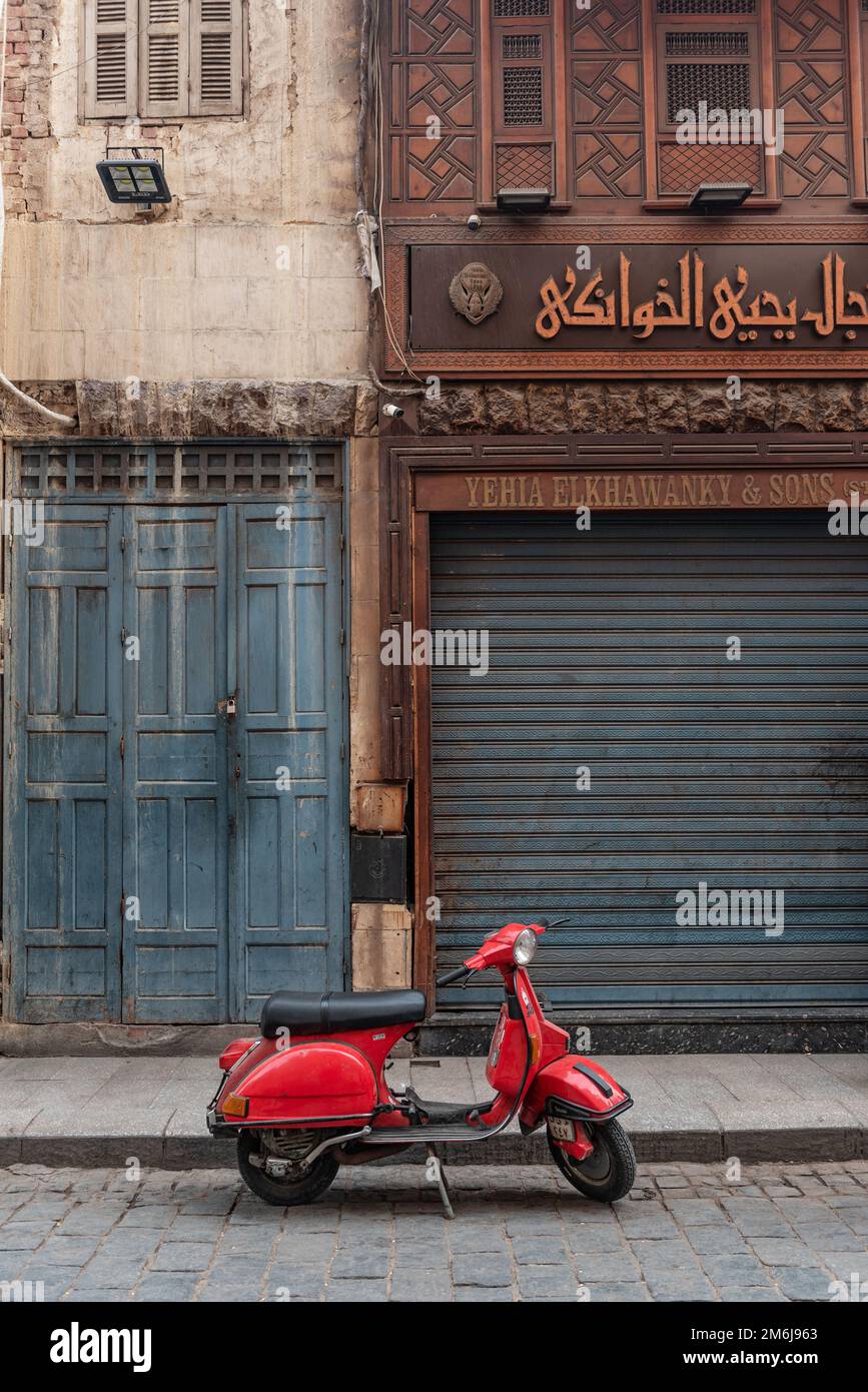 Cairo, Egypt, November 26th 2022 Very cool red Vespa motor scooter