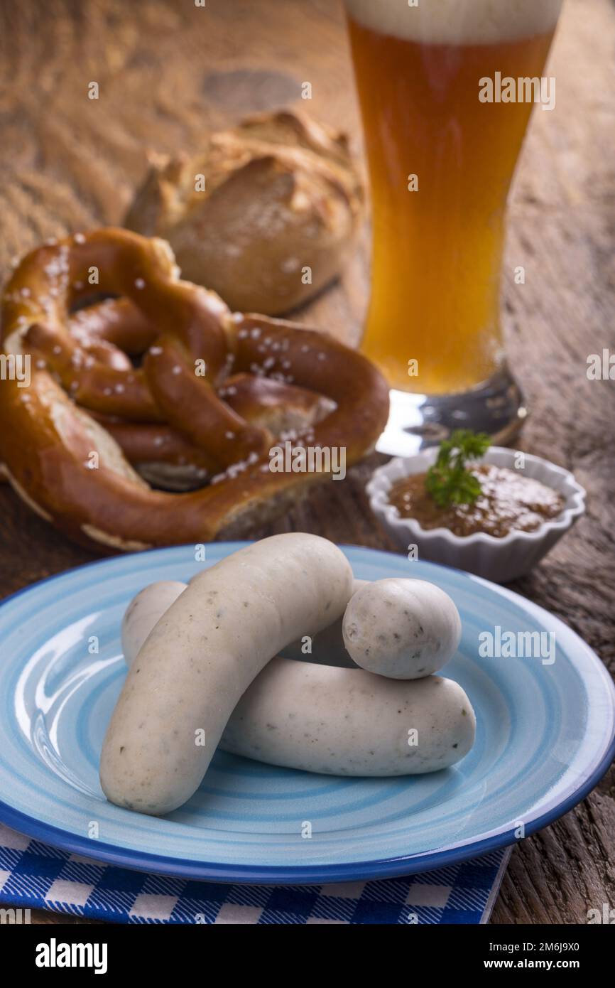 Bavarian white sausage with pretzel on wood Stock Photo