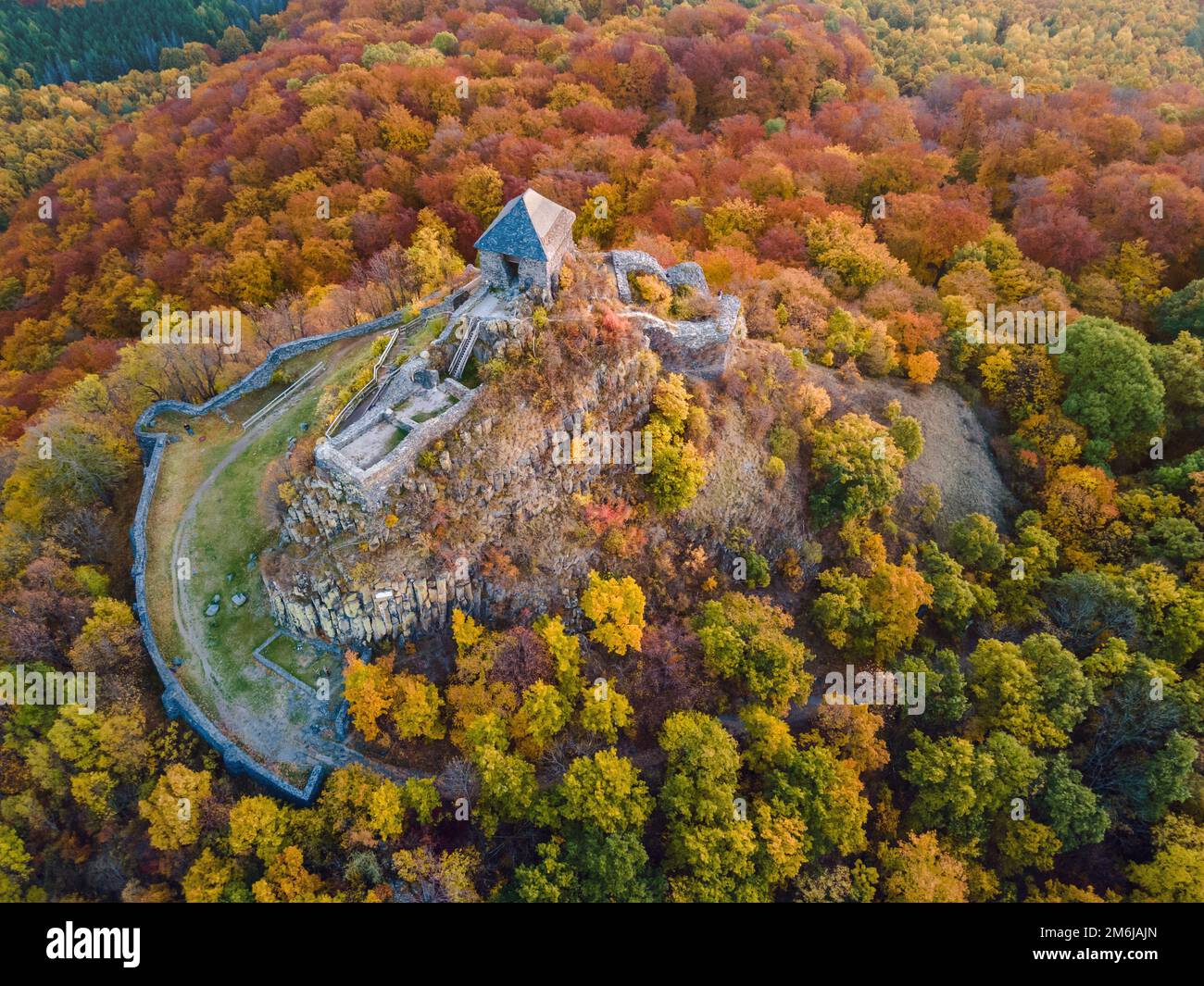 Salgó Castle in a beautiful colorful autumn environment, photographed from above, Salgóbánya, Hungary Stock Photo
