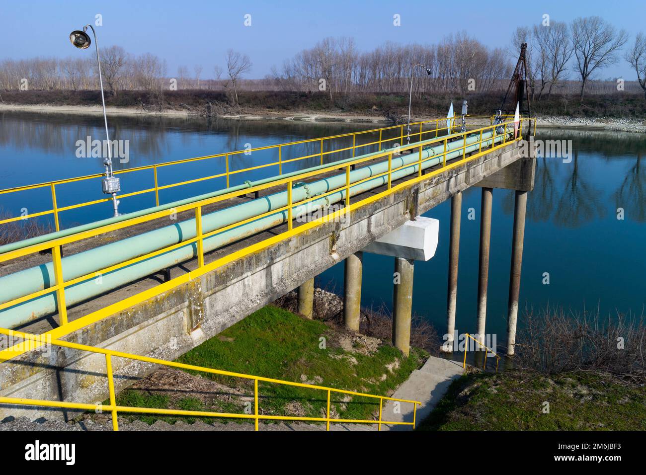 View Of Storage Tank And Pipes Of Chemical Industry Italy Stock Photo view-of-storage-tank-and-pipes-of-chemical-industry-italy-stock-photo
