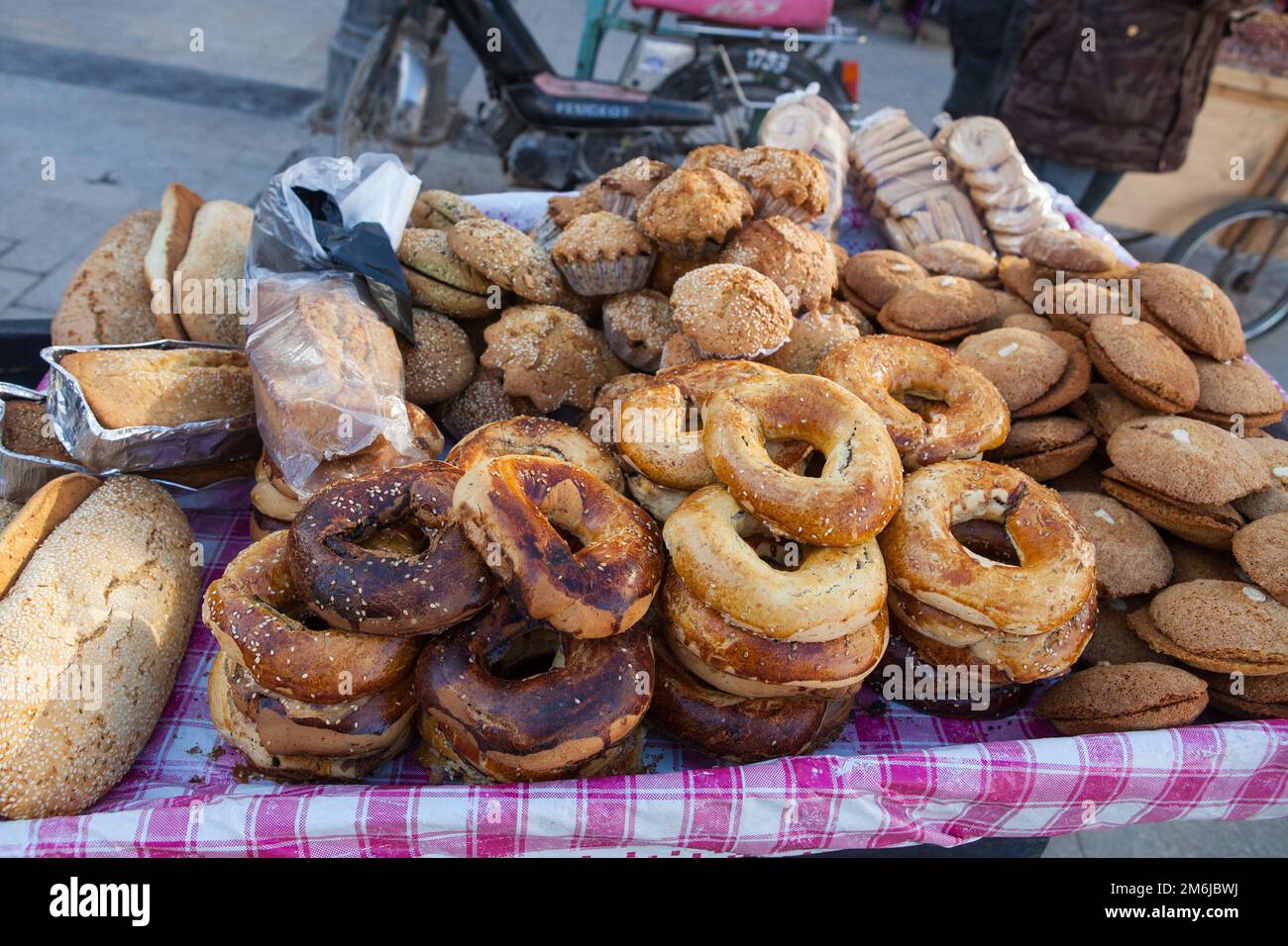 Traditional breads for sale on a market stall in Tunis Stock Photo