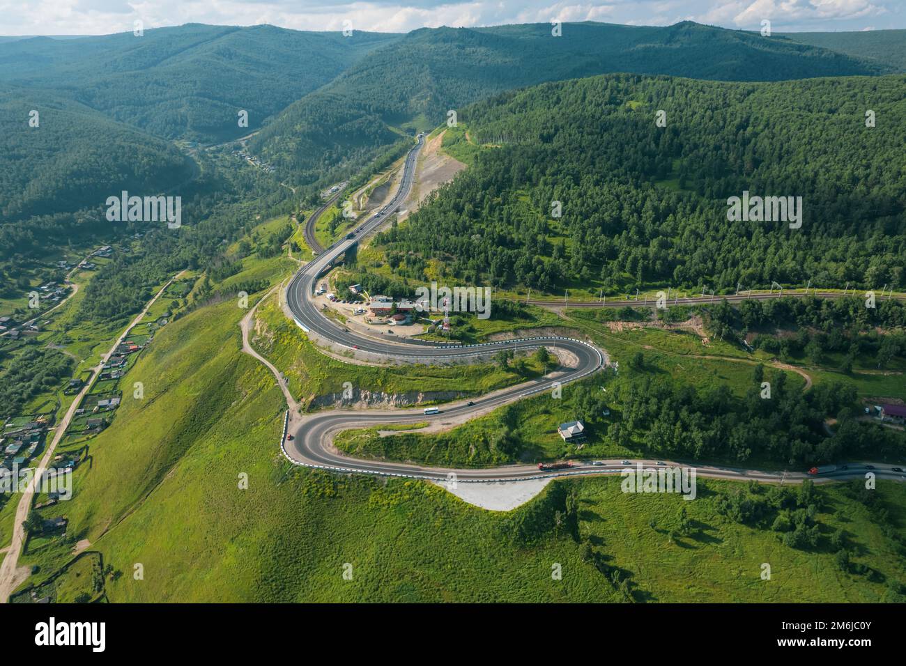 The Baikal serpentine road aerial view of natural mountain valley with serpantine road, Trans