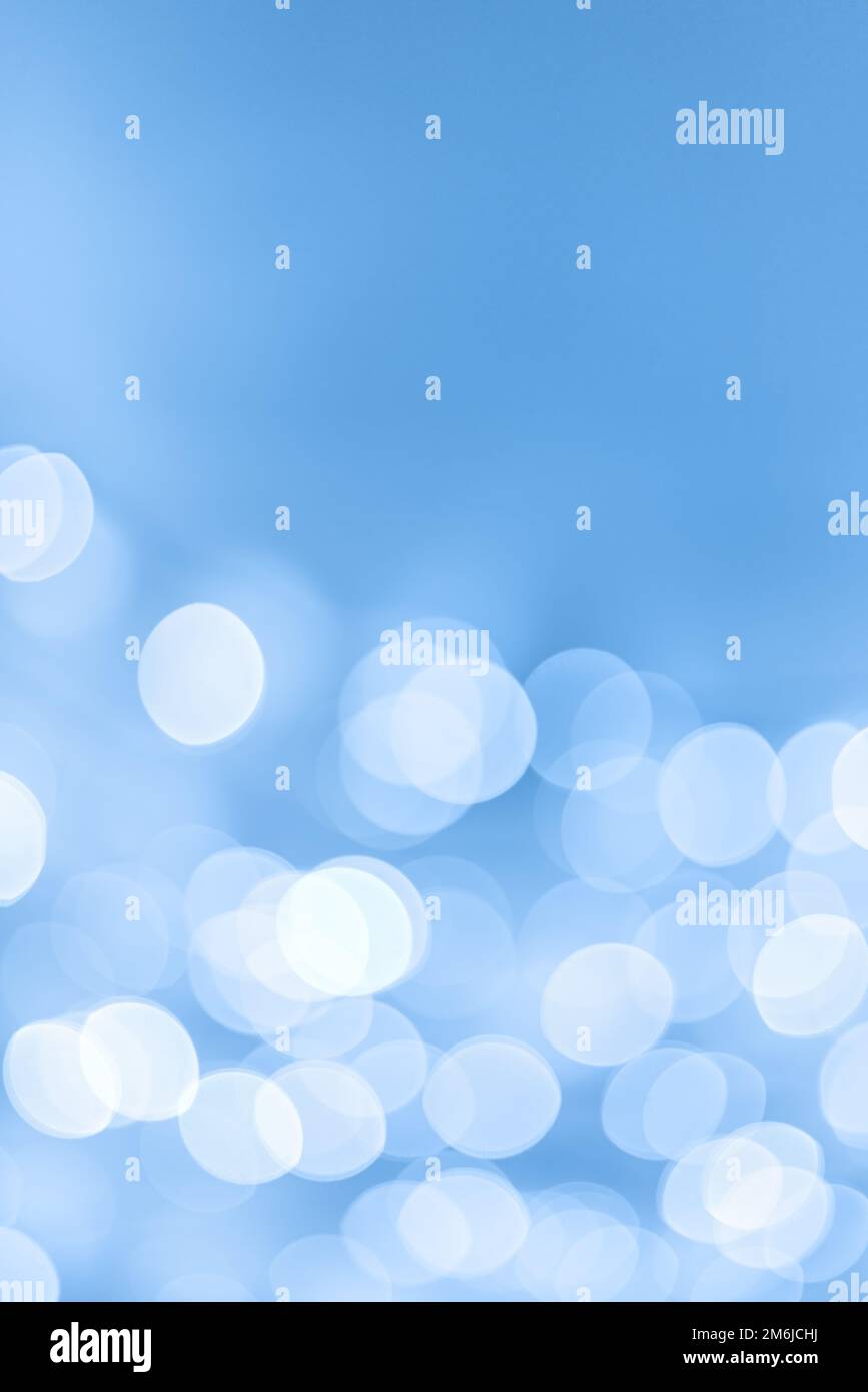 Light blue holiday bokeh Christmas background Stock Photo - Alamy