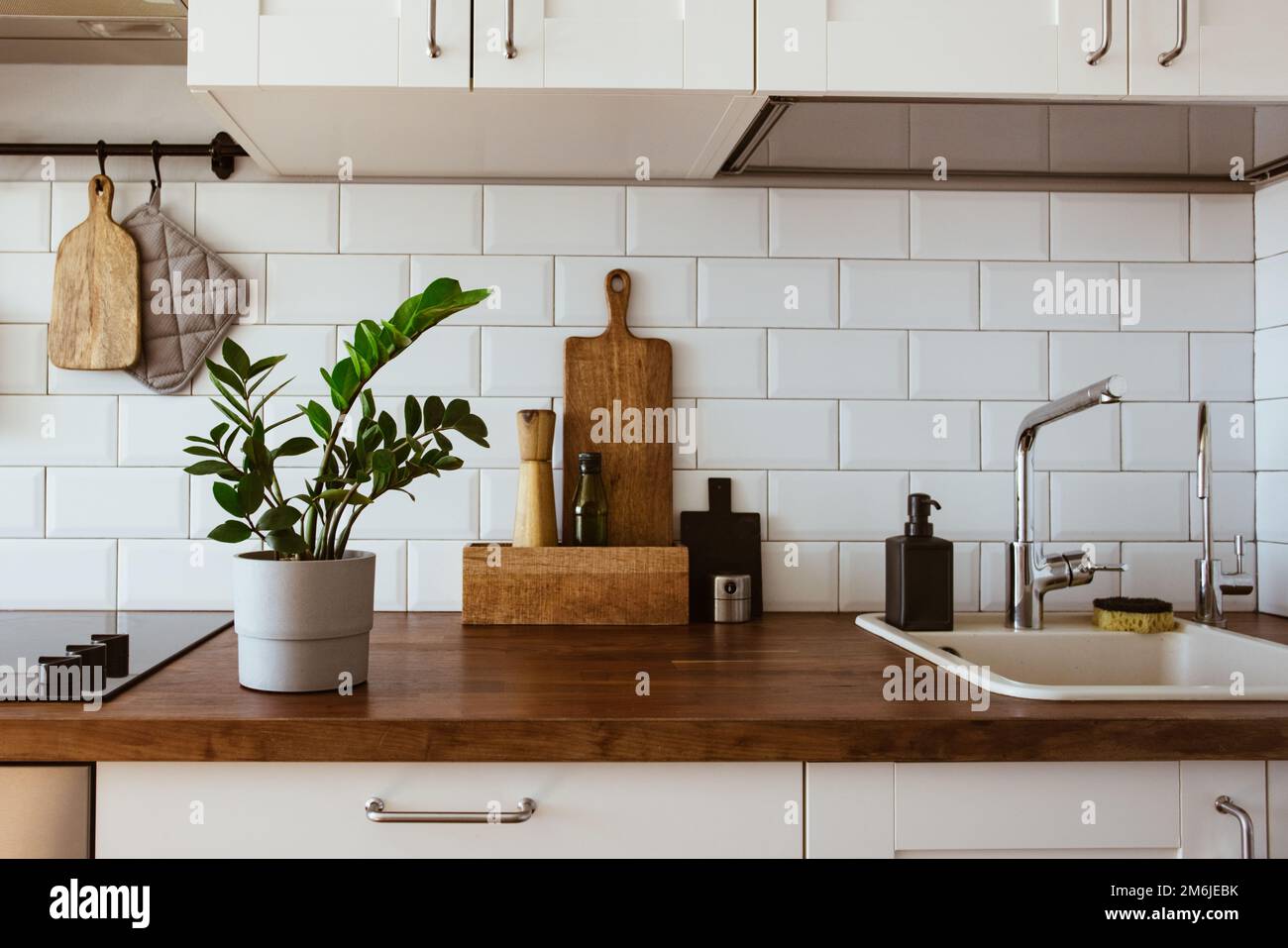 Kitchen brass utensils, chef accessories. Hanging kitchen with white
