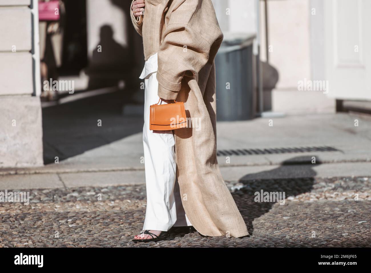 Milan, Italy - February 25, 2022: Street style, woman wearing fashionable outfit. Stock Photo
