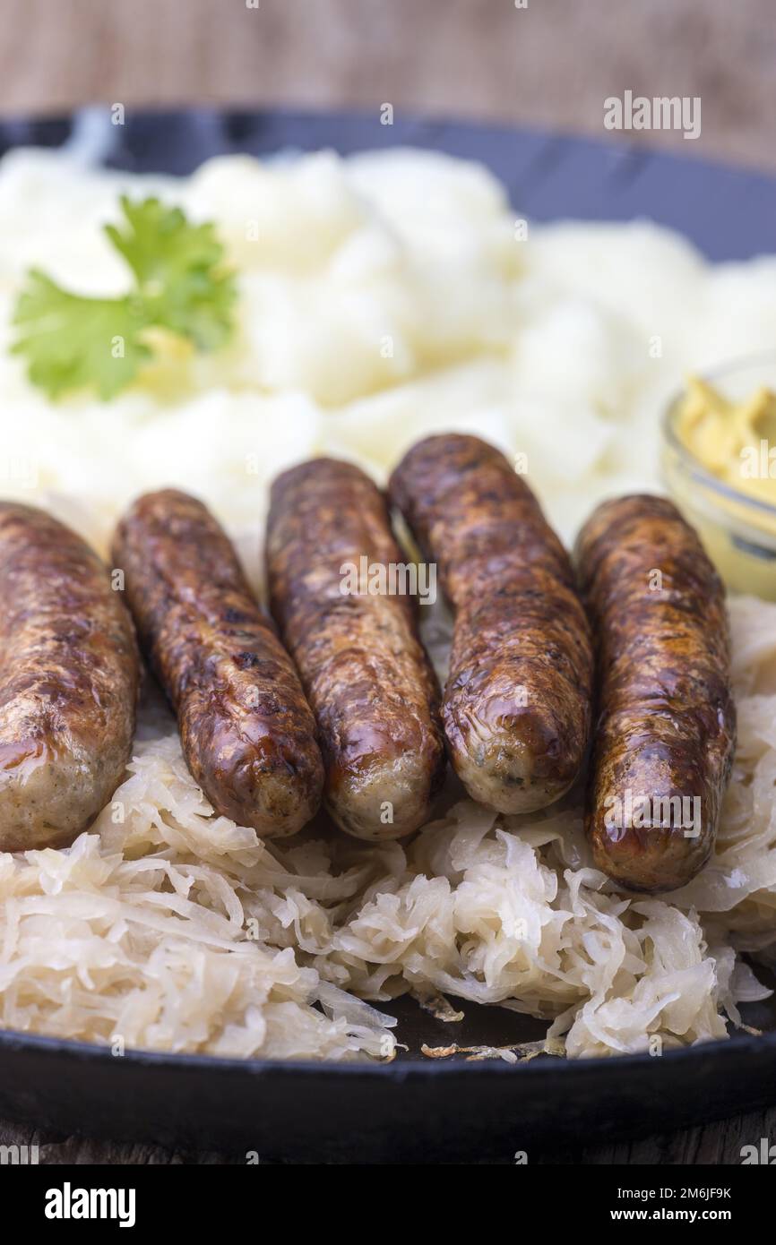 Nuremberg grilled sausages with sauerkraut Stock Photo Alamy