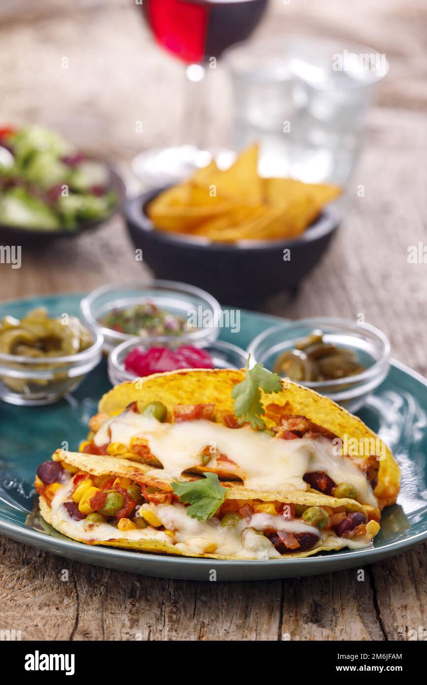 Mexican tacos baked with cheese Stock Photo Alamy
