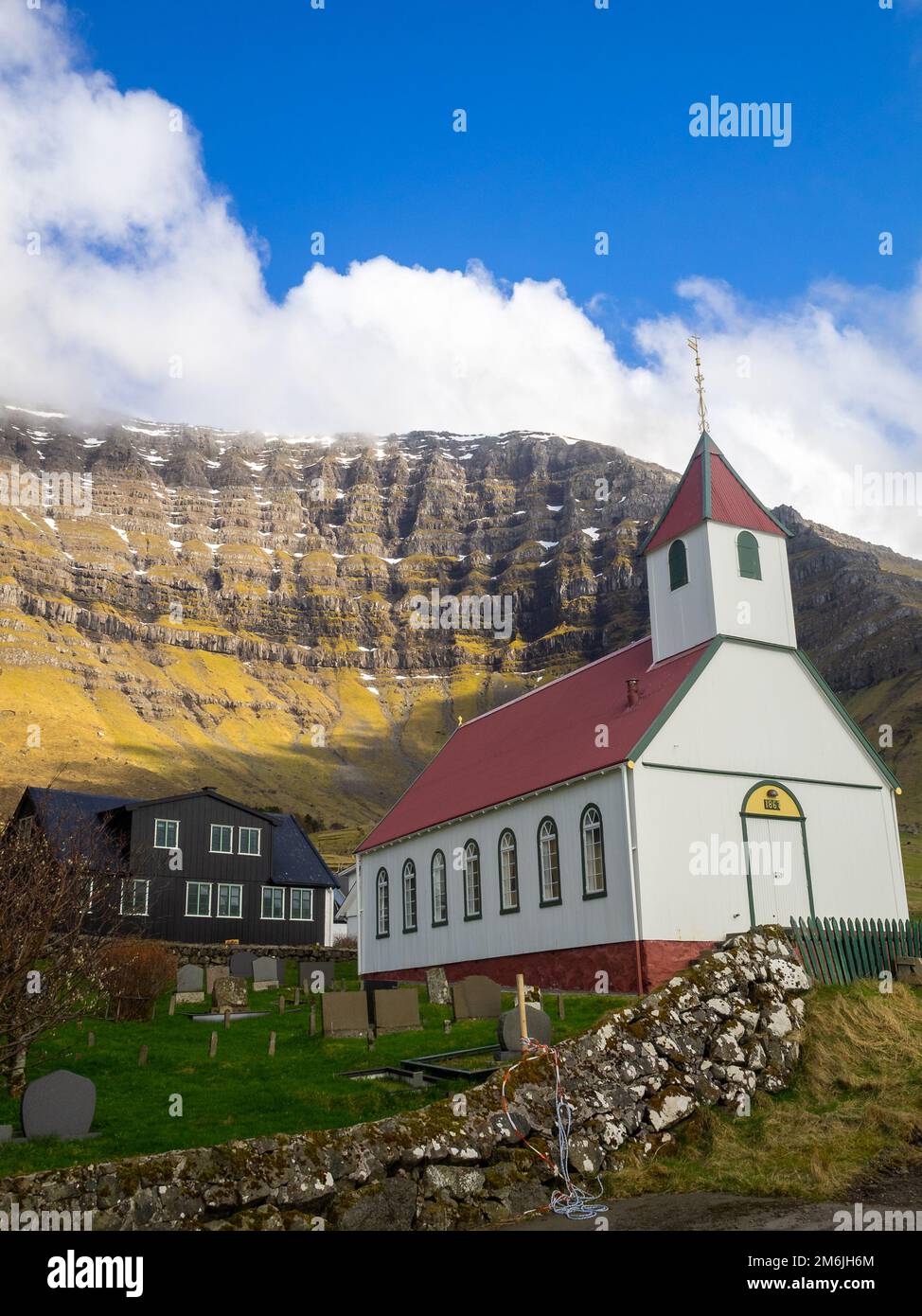 Kunoyar hamlet church below Urðafjall mountain Stock Photo