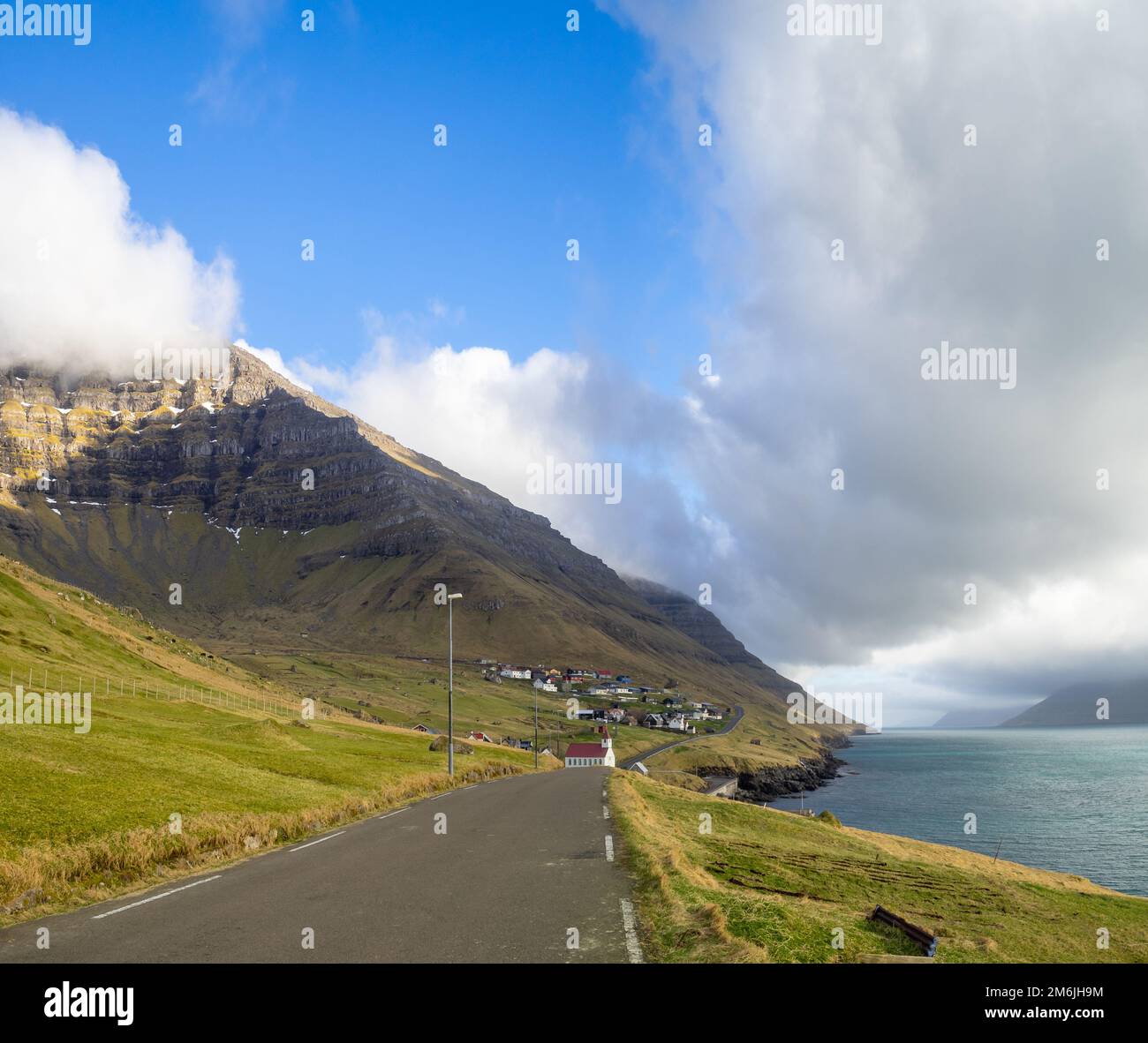 Road along Kalsoyarfjørður fjord in Kunoy island Stock Photo
