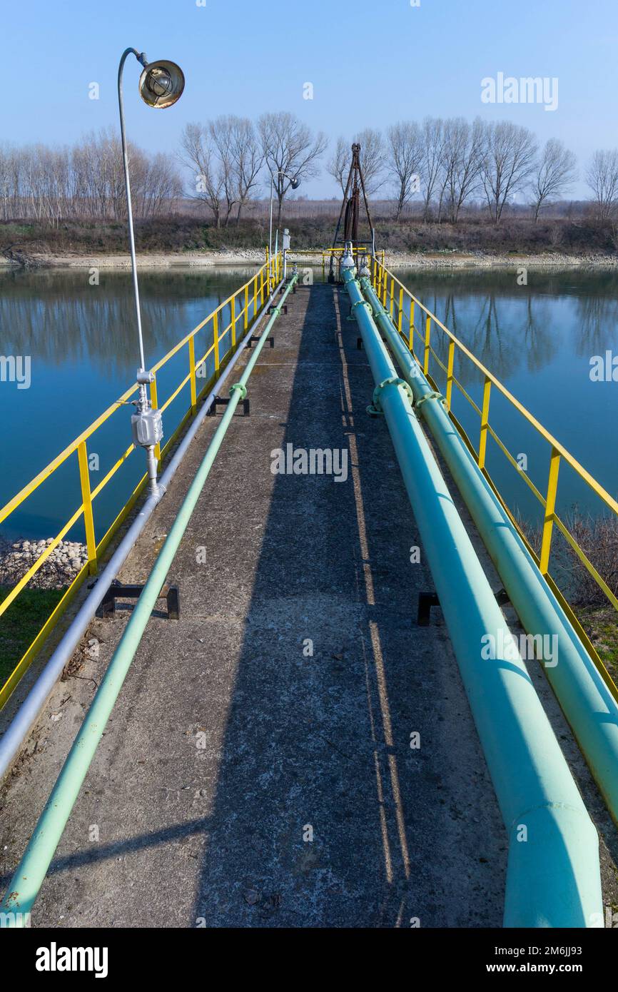 View of storage tank and pipes of chemical industry, Italy Stock Photo