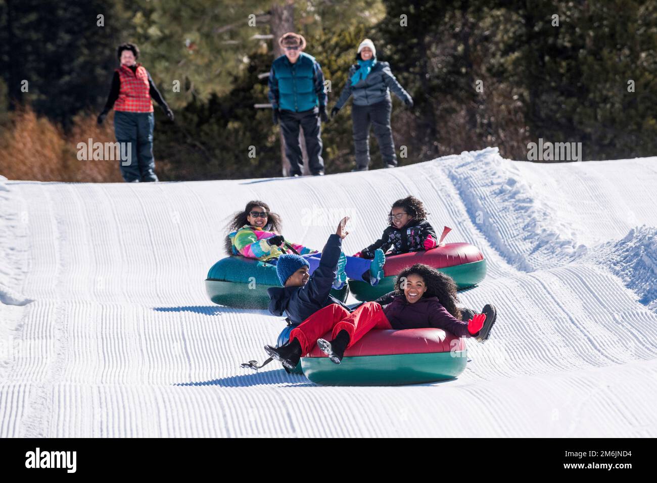A family snow tubing in Stateline, Nevada Stock Photo Alamy