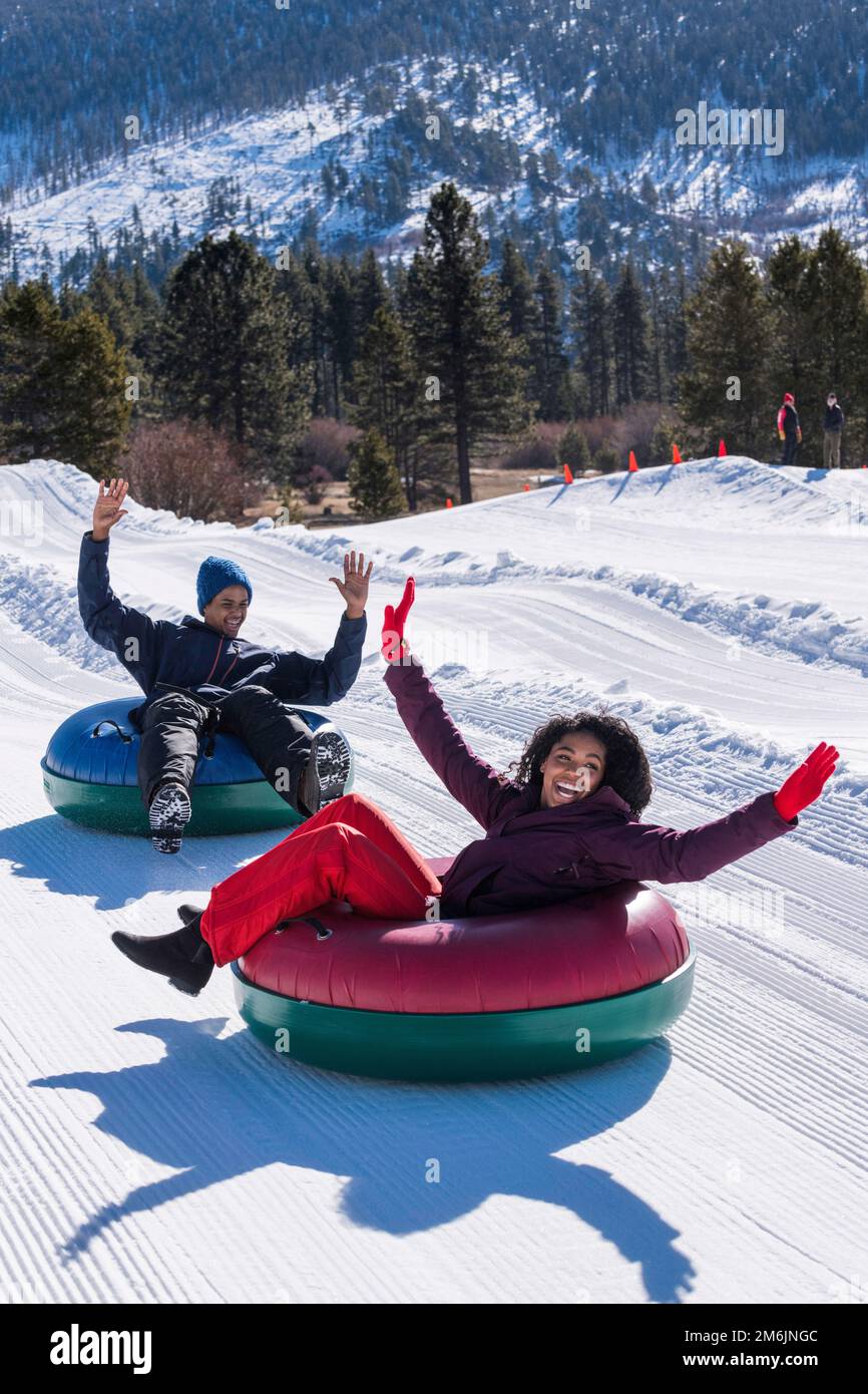 https://c8.alamy.com/comp/2M6JNGC/two-teenagers-snow-tubing-in-stateline-nevada-2M6JNGC.jpg