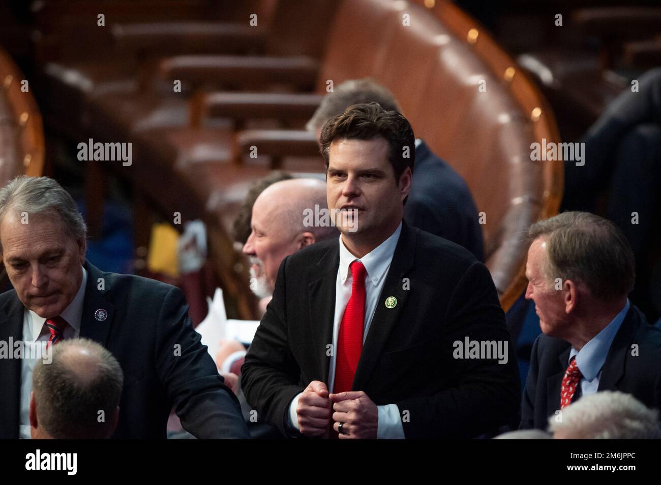 Washington, United States Of America. 03rd Jan, 2023. United States Representative Matt Gaetz (Republican of Florida) chats with others as the 118th Congress votes for Speaker of the House, in the House chamber at the US Capitol in Washington, DC, Tuesday, January 3, 2023.cCredit: Rod Lamkey/CNP/Sipa USA(RESTRICTION: NO New York or New Jersey Newspapers or newspapers within a 75 mile radius of New York City) Credit: Sipa USA/Alamy Live News Stock Photo