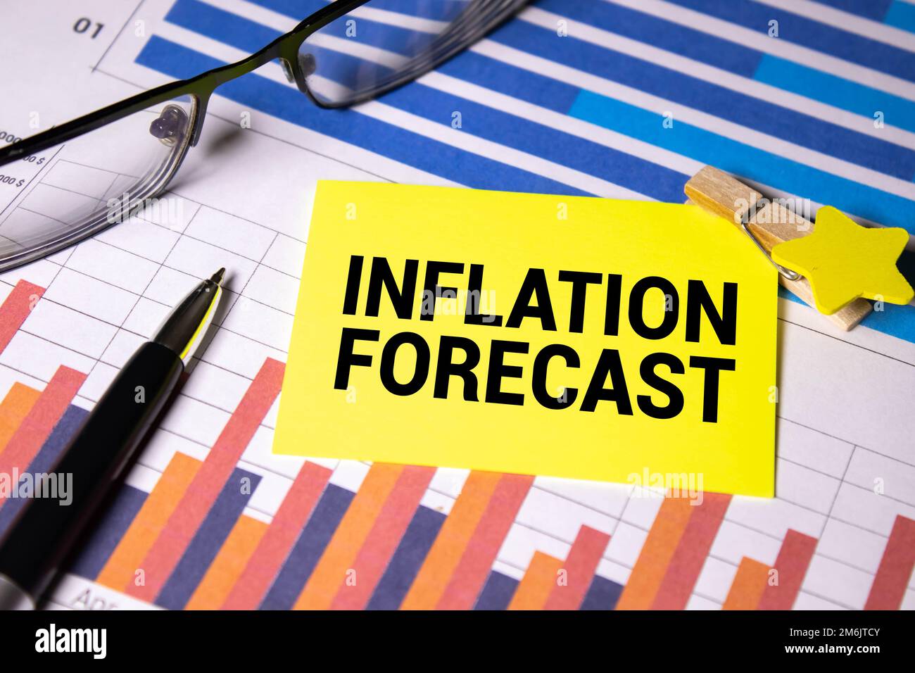 Word Inflation in wooden block on US Dollar bills Stock Photo - Alamy