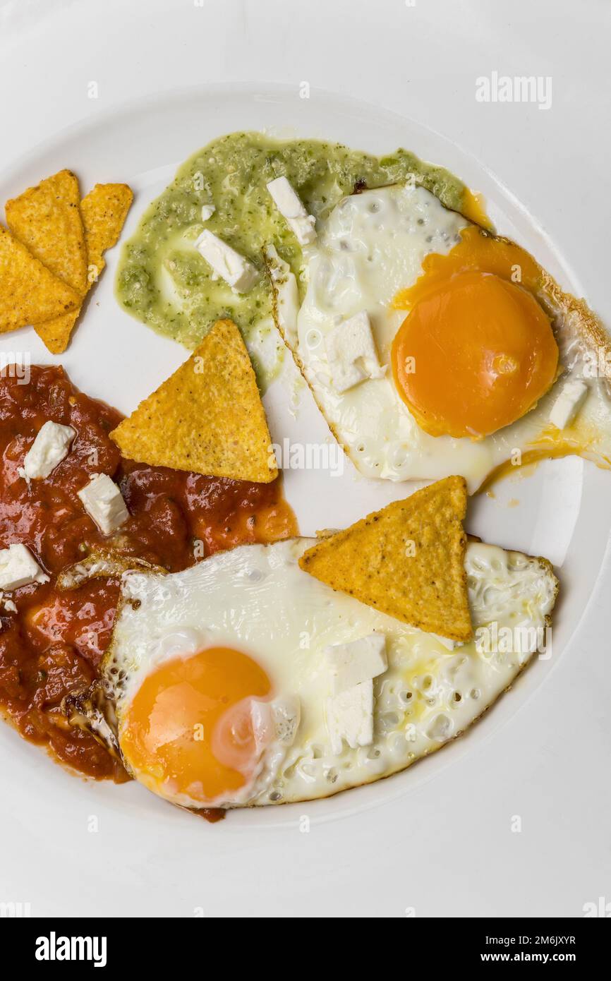 Mexican fried eggs with salsa Stock Photo