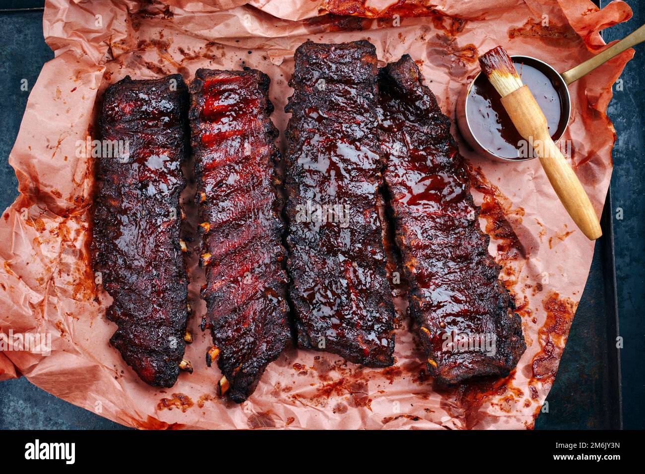 Barbecue pork spare loin ribs St Louis cut with hot honey chili marinade served as top view on a