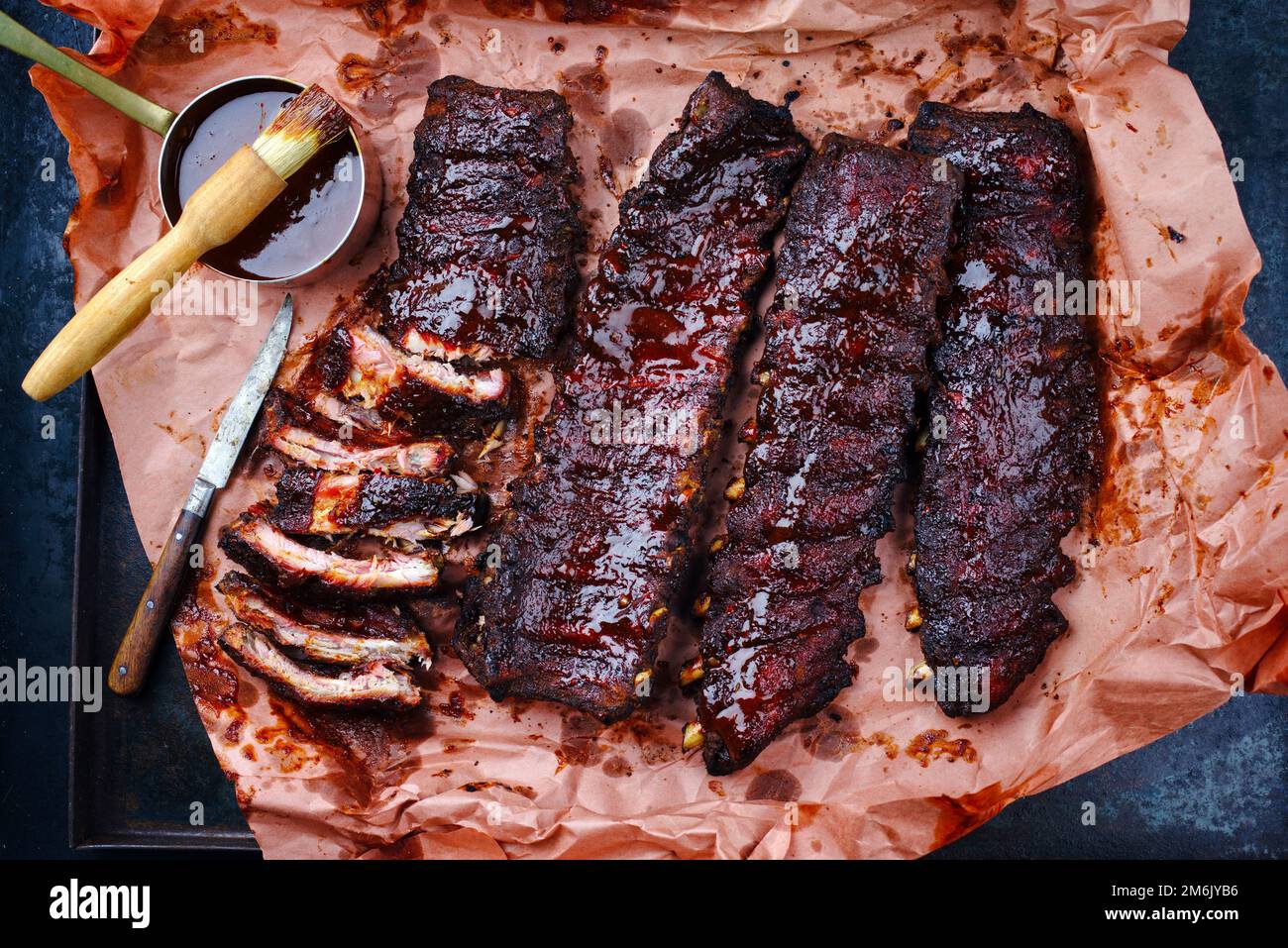 Barbecue pork spare loin ribs St Louis cut with hot honey chili marinade served as top view on a