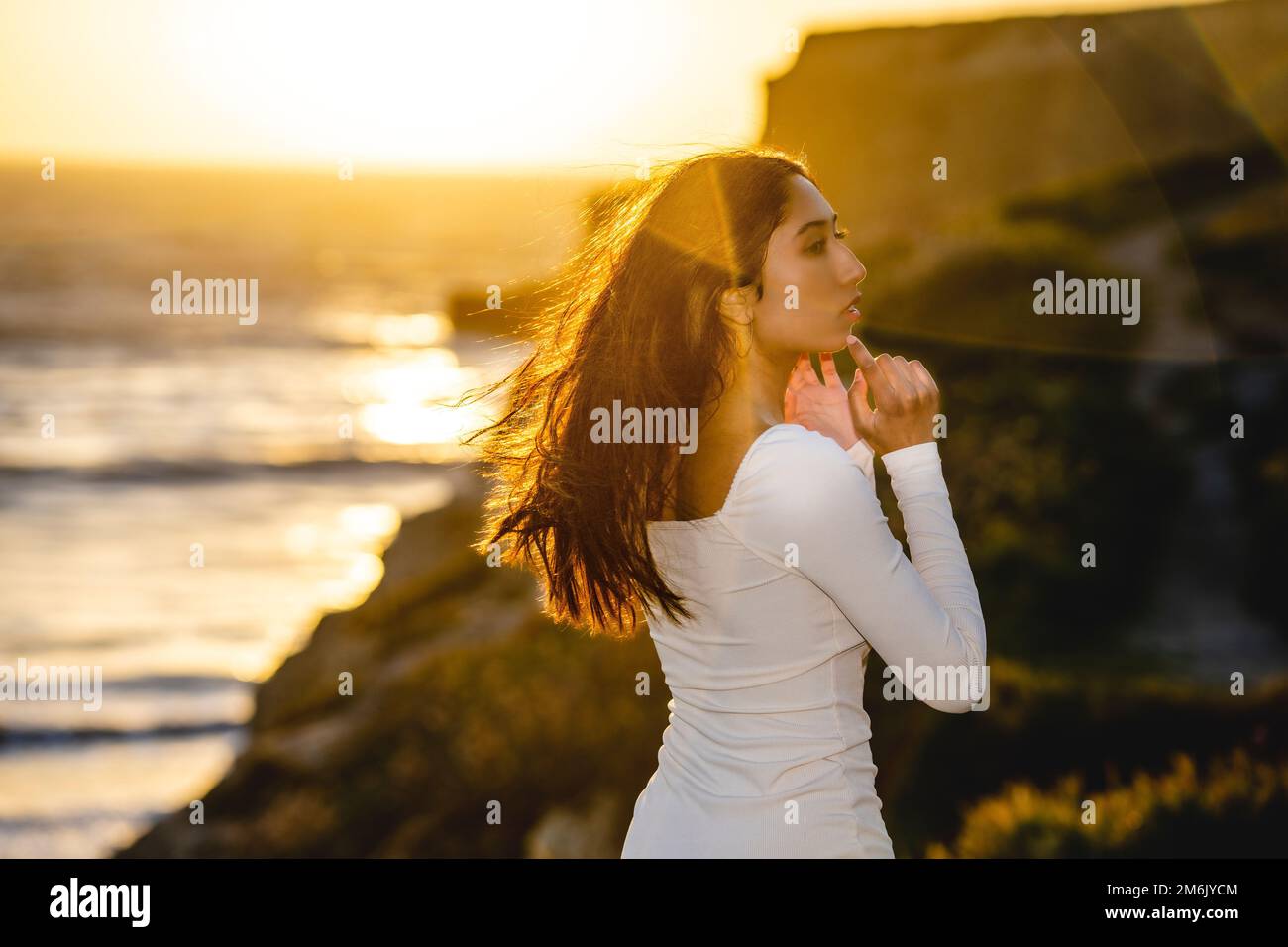 Profile of Beautiful Young Woman Standing at Cliff Edge Overlooking the ...