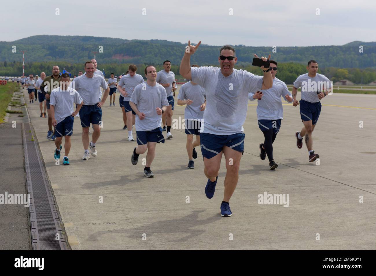 Airmen assigned to the 86th Airlift Wing participate in a wing run on the flightline at Ramstein Air Base, Germany, April 29, 2022. Each squadron under the 86th AW participated in the run to increase morale and physical fitness. Stock Photo