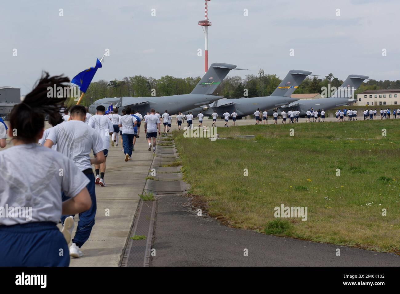 Airmen assigned to the 86th Airlift Wing participate in a wing run at Ramstein Air Base, Germany, April 29, 2022. The 5k run took place on Ramstein’s flightline and hundreds of 86th AW Airmen participated. Stock Photo
